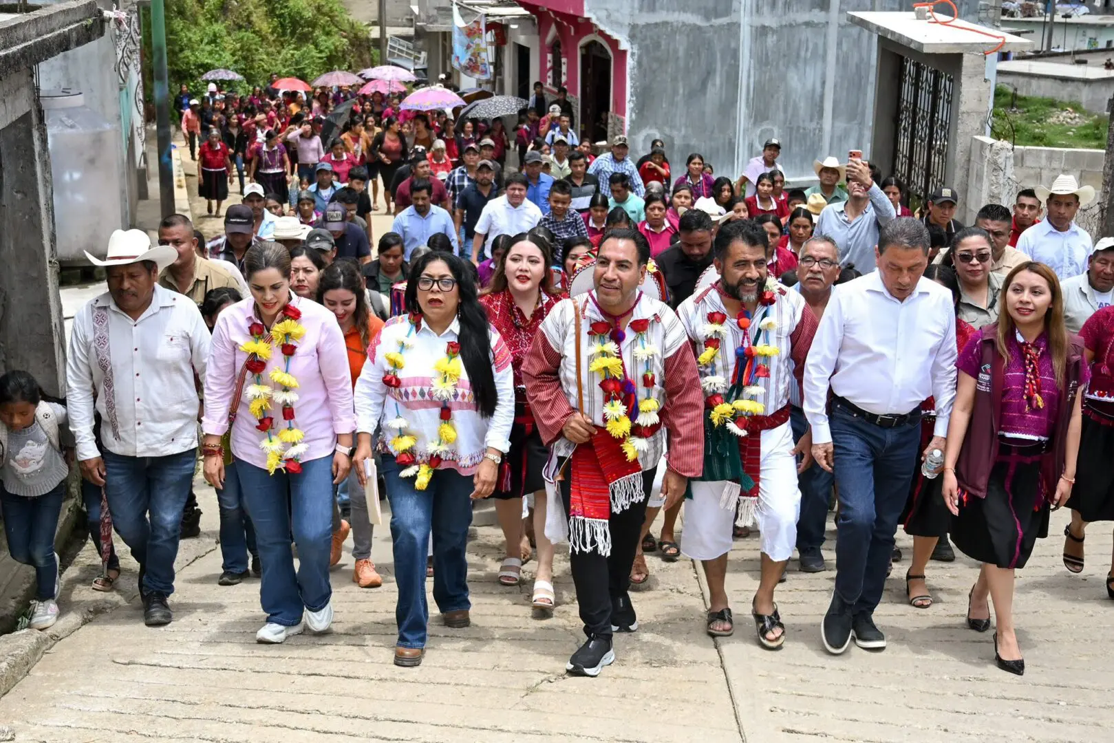 Crowd procession with garlanded community leaders