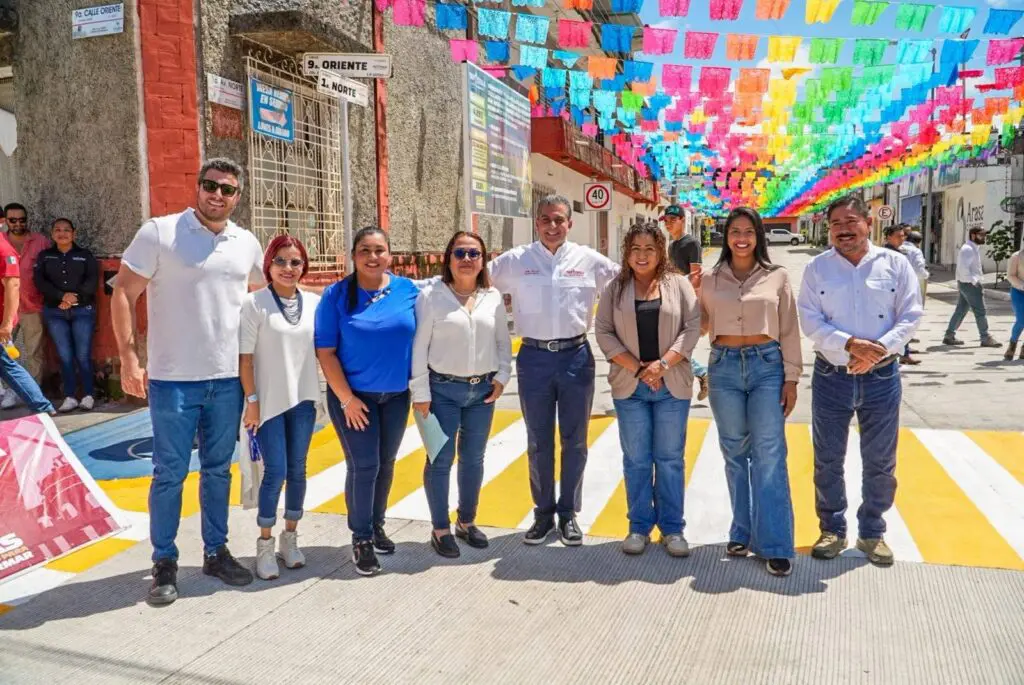 Group of people under colorful street banners