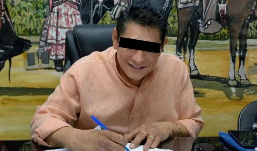 Person signing contract at desk, smiling