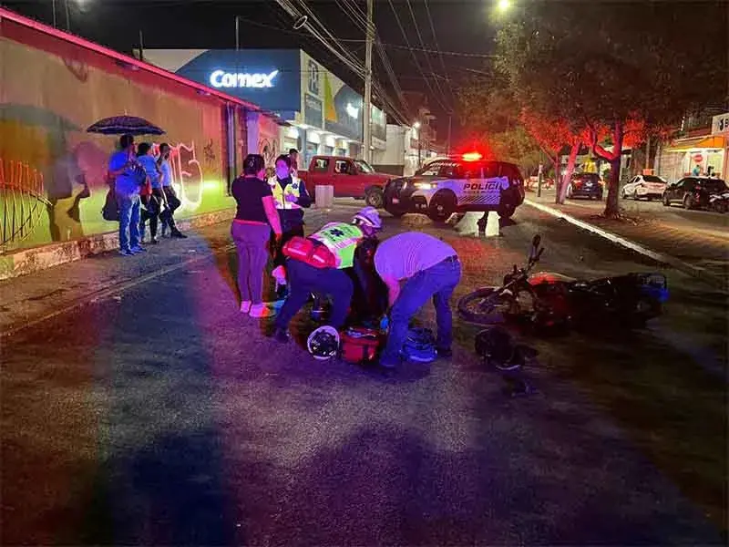 Emergency responders attending motorcycle crash at night