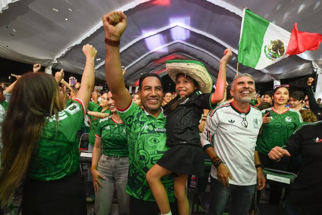 Mexican fans cheering at soccer match