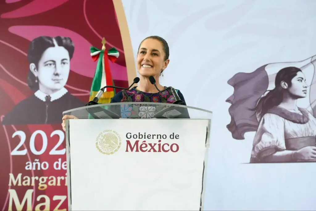 Woman smiling behind podium with historical banners