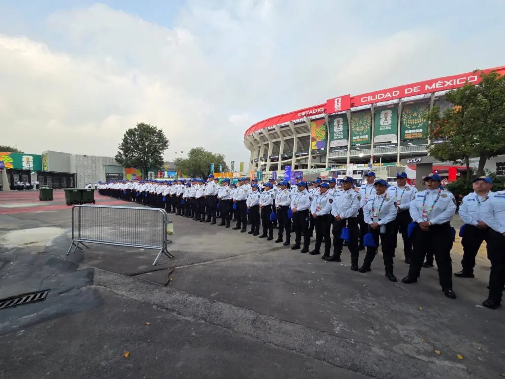 Uniformed security lined up outside stadium