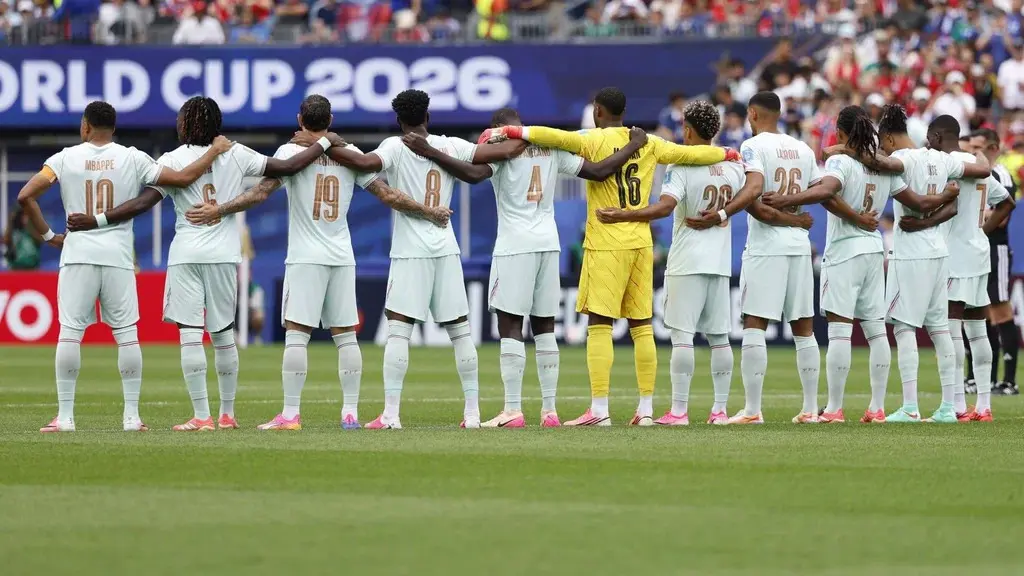 Soccer team linking arms before World Cup