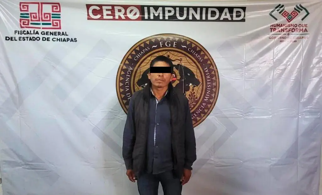 Man with black bar over eyes, official backdrop