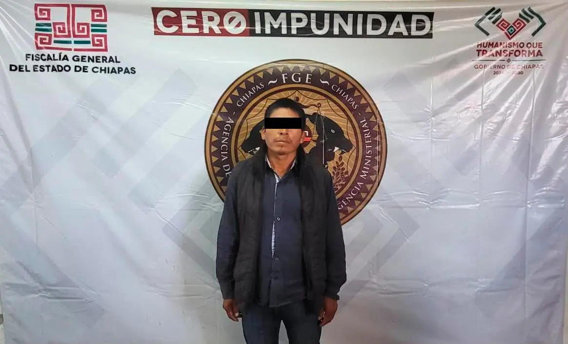 Man with black bar over eyes, official backdrop