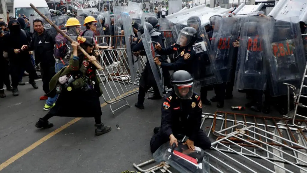 Protesters clashing with riot police and barricades