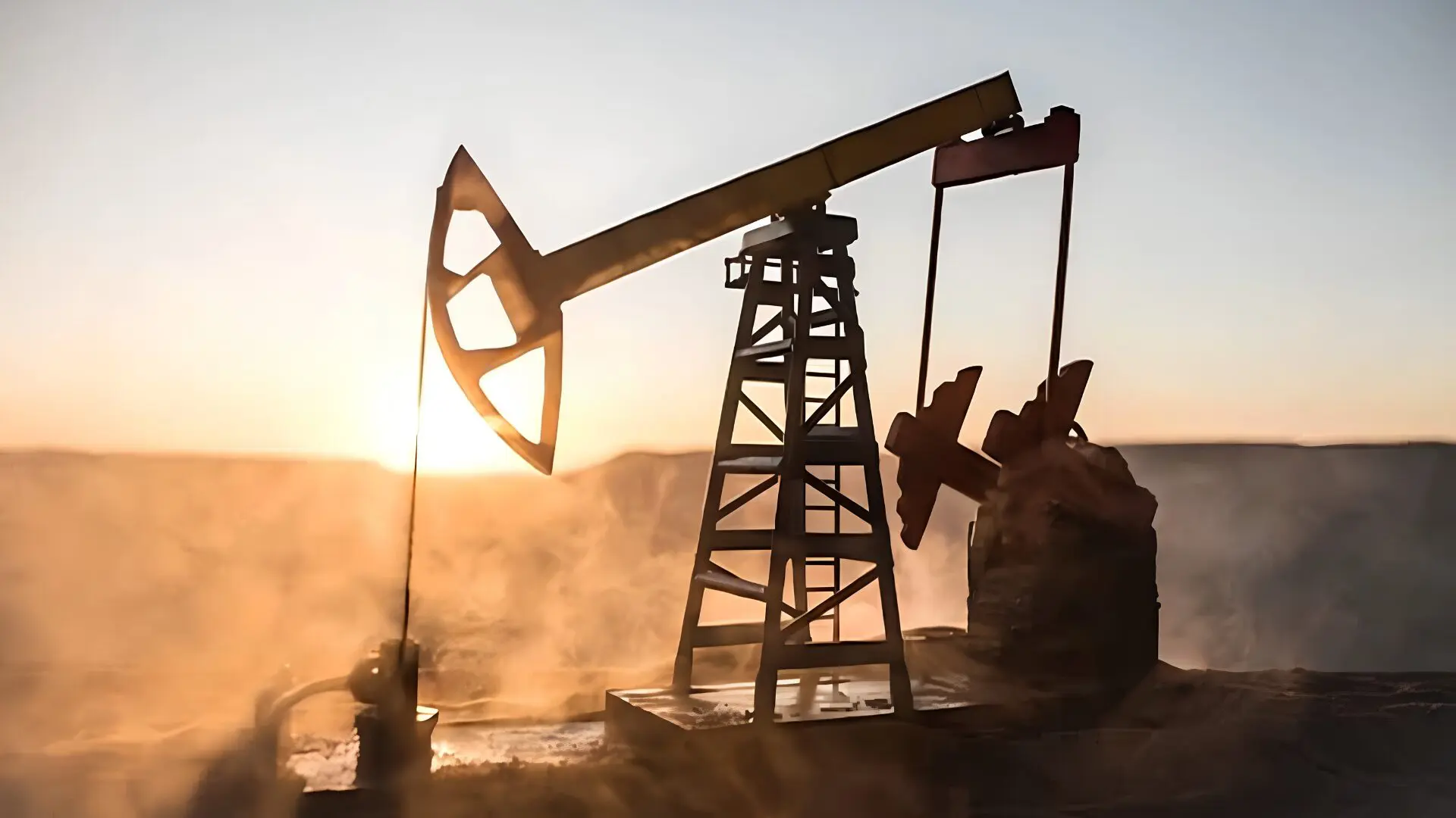 Extracción de petróleo y energía fósil al atardecer