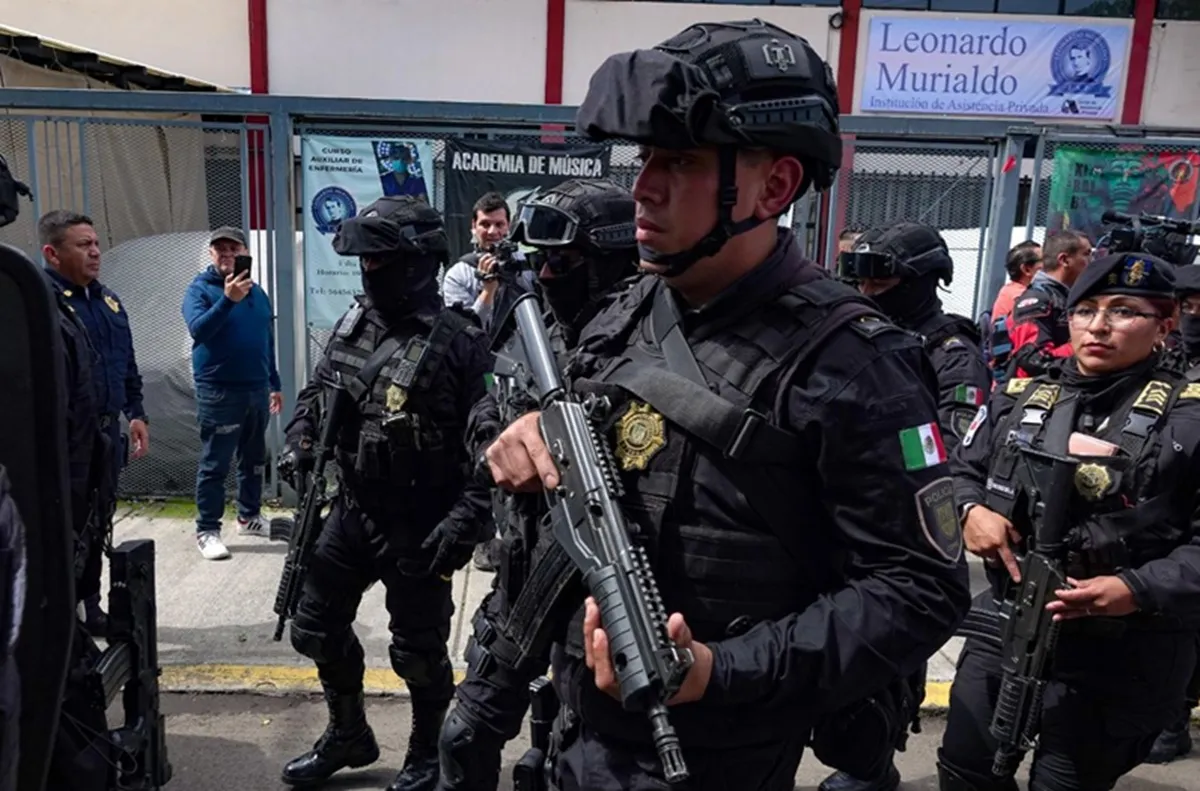 Heavily armed police officers in tactical gear.