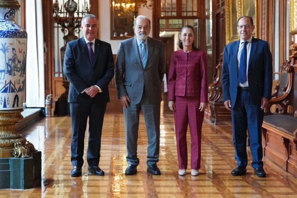Four people standing in a formal setting.
