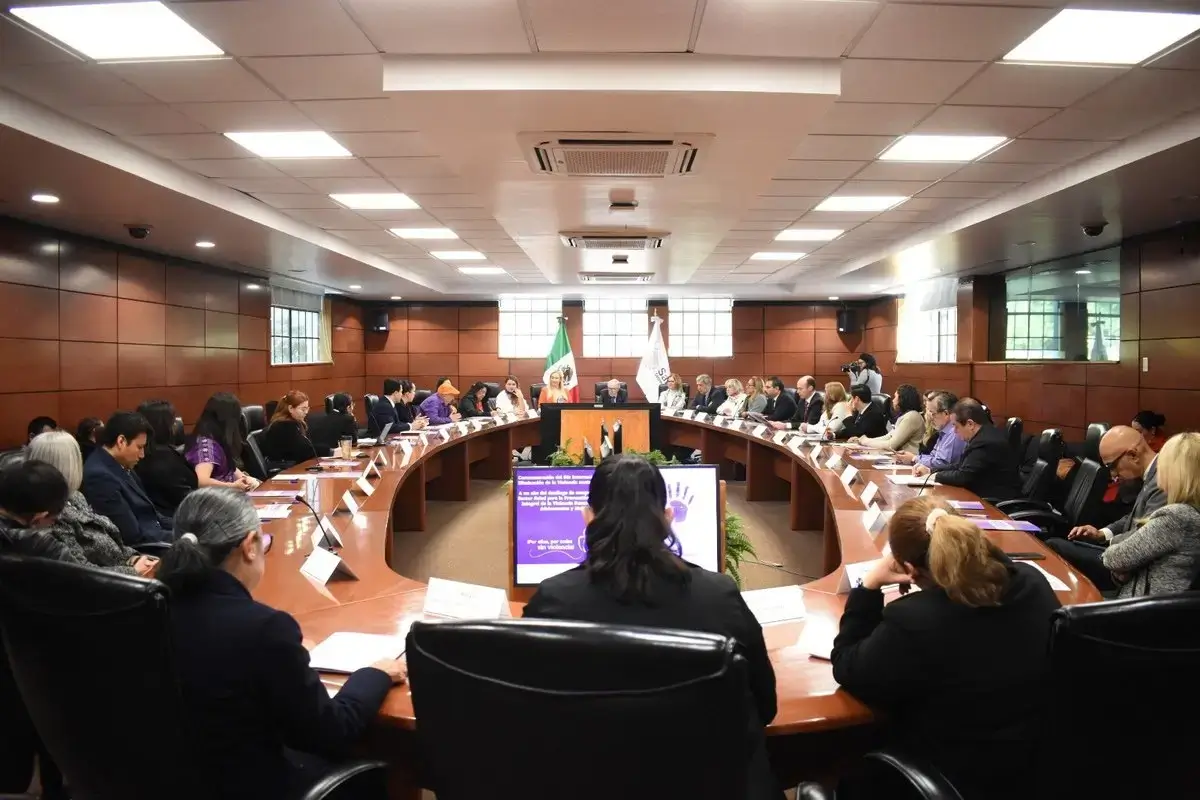 Conference meeting in a large boardroom setting.