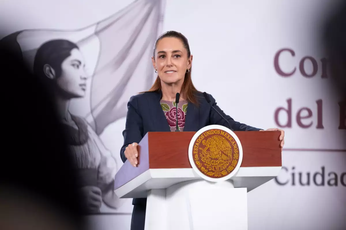 Woman speaking at podium with official seal